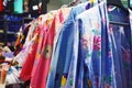 Traditional Japanese female summer garments called `Yukata` with floral patterns on a rack