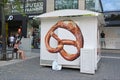 Mobile food stand selling traditiona German baked bread product called `Pretzel` in streets