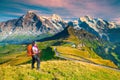 Mannlichen tourist station with backpacker hiker woman, Grindelwald, Switzerland, Europe Royalty Free Stock Photo