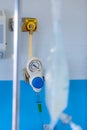 Manometer with reducer for breathing control, help with medical equipment. The oxygen reducer is mounted on the wall with an