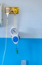 Manometer with reducer for breathing control, help with medical equipment. The oxygen reducer is mounted on the wall with an Royalty Free Stock Photo