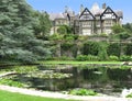 Manor house and pond at Bodnant Garden