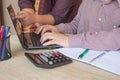 Mans accountants counting on calculator income for tax form completion hands closeup. Internal Revenue Service inspector checking