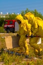 Mans with briefcase in protective hazmat suit