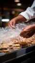 Mans close up action securing cookies inside a plastic bag during grocery shopping