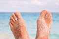 Mans Feet on the beach