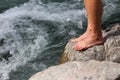 Mans feet on a stone, ready for hardening Royalty Free Stock Photo