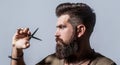 Mans haircut in barber shop. Barber scissors, barber shop. Barber scissors. Vintage barbershop, shaving. Male in