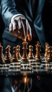 A mans hand, focused on chess, illustrates business planning and metaphorical comparison