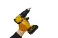 Mans hand in gloves holds an electric screwdriver on a battery, on a white background