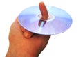 Mans hand holding compact disc on the finger isolated Royalty Free Stock Photo