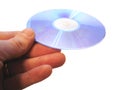 Mans hand holding compact disc on the finger isolated Royalty Free Stock Photo