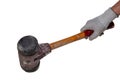 Mans hand holds an professional paving hammer with cast steel body, wooden handle and double sided striking heads isolated on