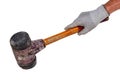 Mans hand holds an professional paving hammer with cast steel body, wooden handle and double sided striking heads isolated on