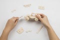 Mans hands assembling wooden jeep toy Royalty Free Stock Photo