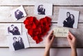 Mans hands. His and his girlfriends photo. Rose petal heart. Royalty Free Stock Photo
