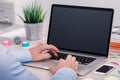 Mans hands keyboarding on macbook laptop with blank screen mockup Royalty Free Stock Photo