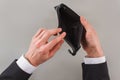 Mans hands open an empty wallet. Royalty Free Stock Photo