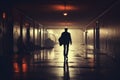 A mans silhouette moves through a vacant hallway, capturing a lonely ambiance