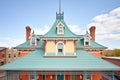 mansard roof on a victorian home with iron cresting