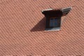 Mansard window in old tiled roof Royalty Free Stock Photo