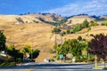 Mansions built on golden hills covered in dry grass, beautiful evening light; south San Jose, San Francisco bay area, California Royalty Free Stock Photo