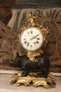 Mantel clock on the mantelpiece. Hermitage Museum