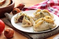 Manti dumpling on white plate.