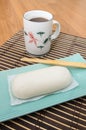 Mantou Chinese steamed bun in green dish on bamboo mat