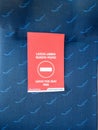 Mantova, Italy - 20th June 2020: close up of trenitalia train seat with a red sign that says to leave seat free