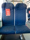 Mantova, Italy - 20th June 2020: trenitalia train seats with a red sign that says to leave seat free