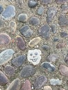 Stone used as a background for drawing a human face