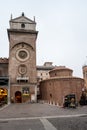Mantua, Lombardy, Italy, December 2015: The Clock Tower of Rotonda di San Lorenzo church located in Piazza delle Erbe