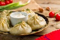 Manty with beef and sour cream, uzbek cuisine close up Royalty Free Stock Photo