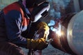 Manual arc welding of large diameter pipeline elements Royalty Free Stock Photo