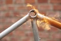 Manual bicycle renovation work, paint removal process using a torch fire