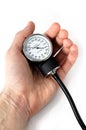 Manual blood pressure monitor in hand medical tool isolated Royalty Free Stock Photo