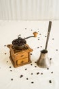Manual coffee grinder and germal silver cezve (ibrik) Royalty Free Stock Photo