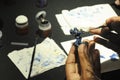 Manual hand painting to small statue using a small brush.