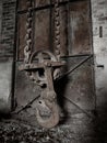 Huge hoist at the end of a chain in an abandoned factory