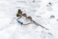 Manual ice ax. The ice ax lies in the snow. Hand drill