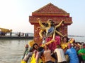 A manual immersion going on  in the holy river Ganges at calcutta with a background of Howrah. Royalty Free Stock Photo