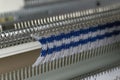 Manual knitting machine. A knitting machine is a device used to create knitted fabrics