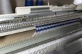 Manual knitting machine. A knitting machine is a device used to create knitted fabrics