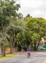 Manual mail deliveries by a postman on a bicycle in South Africa