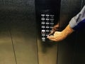 Manual pressing the elevator hold button, elevator control button panel Royalty Free Stock Photo