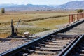 manual railroad switch with lever and counterweight at summer day