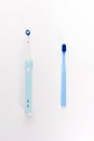 Manual Regular Toothbrush Against Modern Electric Toothbrush