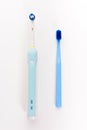 Manual Regular Toothbrush Against Modern Electric Toothbrush.