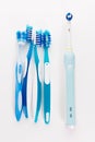 Manual Regular Toothbrush Against Modern Electric Toothbrush